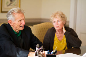 concerned elderly couple asking about trust planning